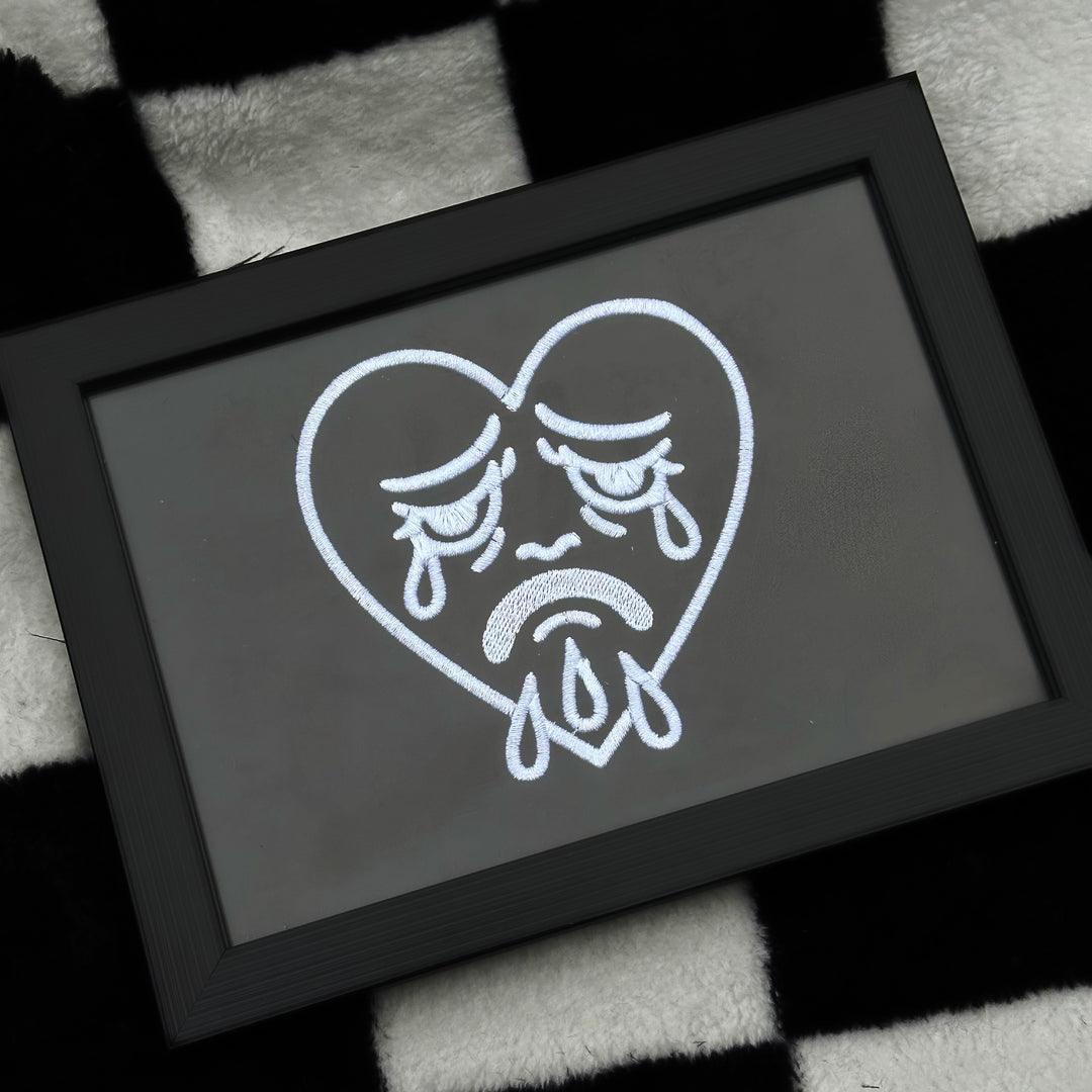 CRYING HEART EMBROIDERED BLACK FRAME