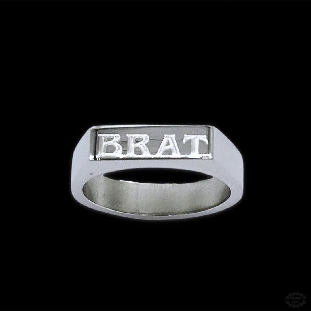 ‘BRAT’ ENGRAVED STAINLESS STEEL RING